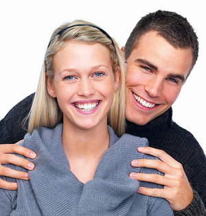 Couple smiling after undergoing periodontal treatment in Worcester & Central, MA